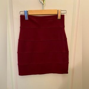 Burgundy skirt.